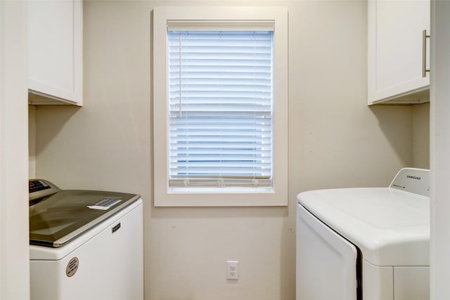 laundry area with cabinets and washer and dryer