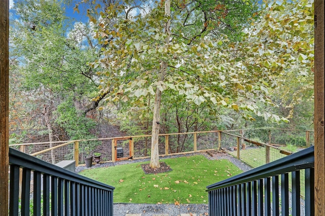 wooden deck with a lawn