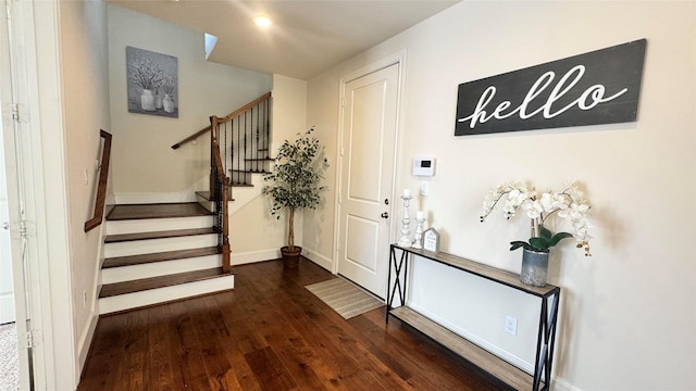 entrance foyer with dark hardwood / wood-style flooring