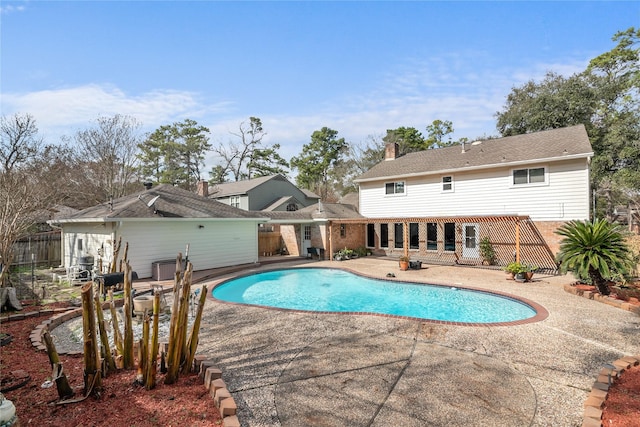 view of swimming pool featuring a patio area