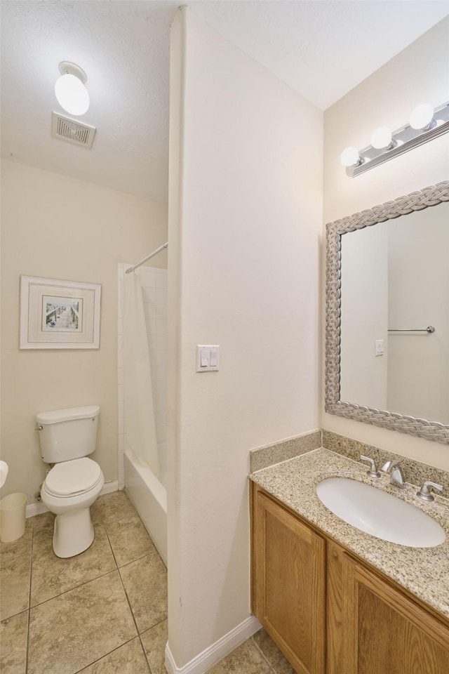 full bathroom featuring tile patterned floors, toilet, vanity, and shower / bath combo