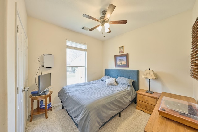 carpeted bedroom featuring ceiling fan