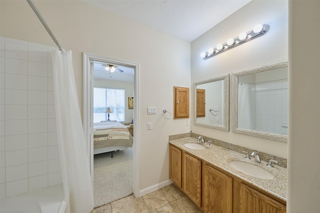 bathroom with tile patterned floors, shower / tub combo, and vanity