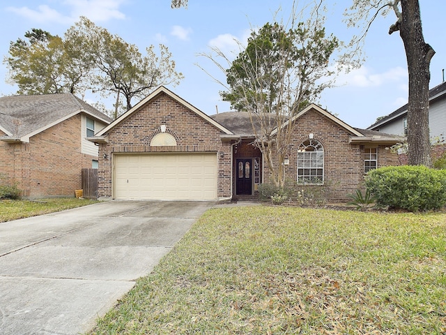 view of front facade featuring a garage and a front lawn