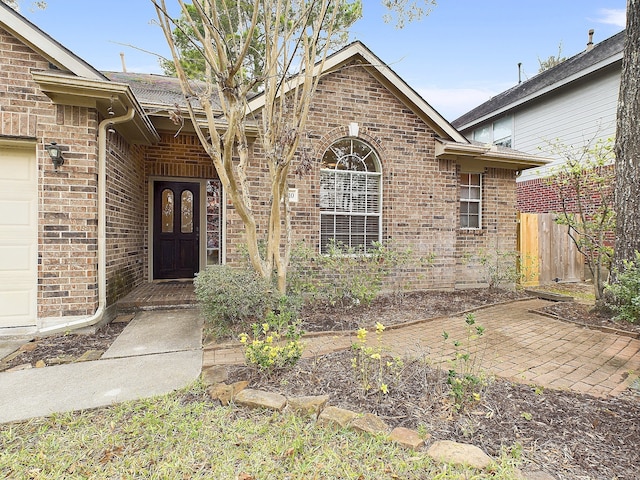 doorway to property featuring a garage