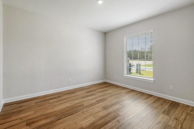 spare room with light hardwood / wood-style flooring