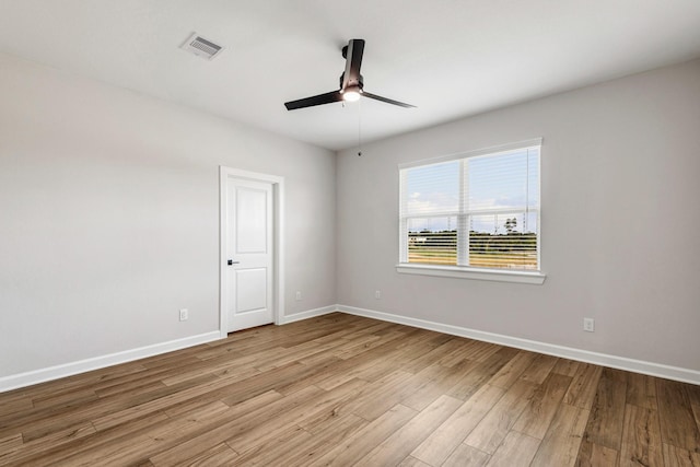 unfurnished room featuring ceiling fan and light wood-type flooring