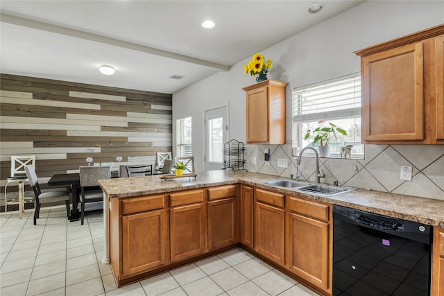 kitchen featuring sink, black dishwasher, a wealth of natural light, decorative backsplash, and kitchen peninsula