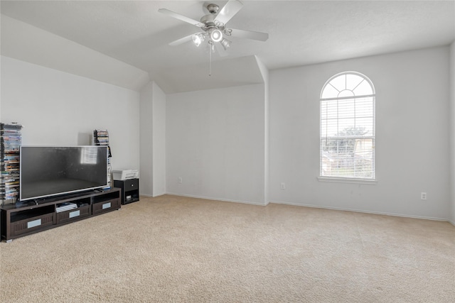 carpeted living room featuring vaulted ceiling and ceiling fan