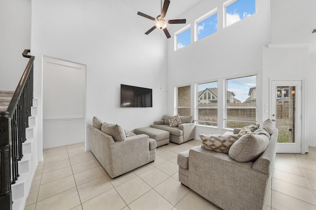 living room featuring light tile patterned floors and ceiling fan