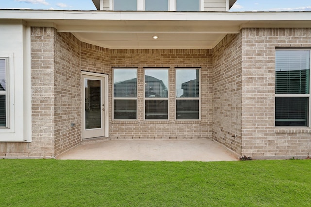 exterior space with a yard and a patio area