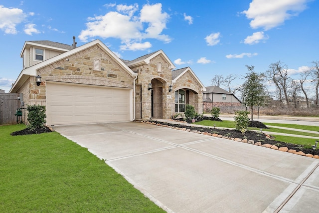 view of front of home featuring a garage and a front yard