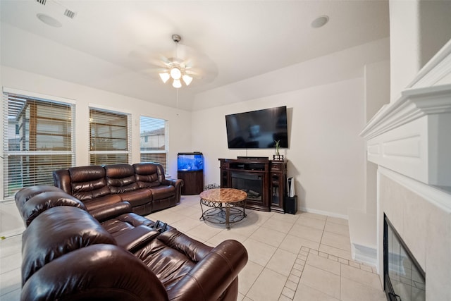 tiled living room featuring ceiling fan