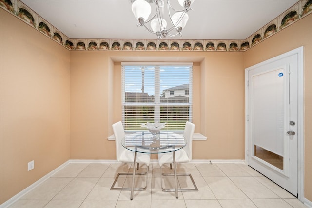 dining area featuring a chandelier and light tile patterned floors