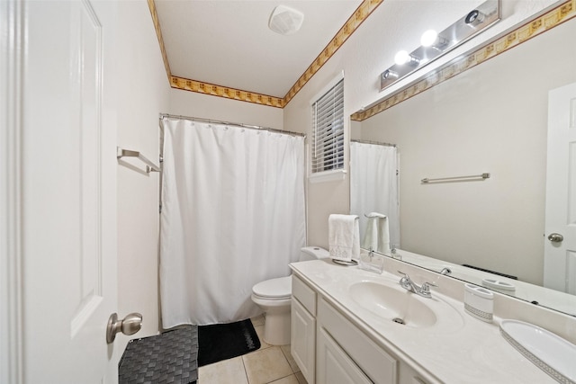 bathroom featuring tile patterned floors, toilet, and vanity