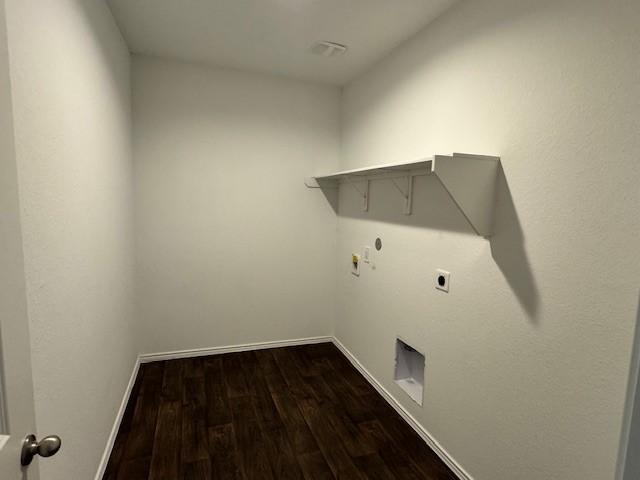 laundry area featuring electric dryer hookup, hookup for a gas dryer, and hardwood / wood-style flooring