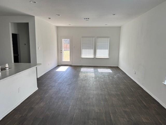 spare room featuring dark hardwood / wood-style floors