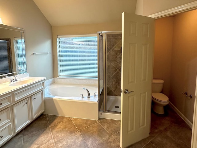 full bathroom with lofted ceiling, toilet, separate shower and tub, vanity, and tile patterned flooring