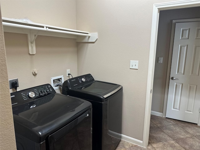 clothes washing area with washer and dryer