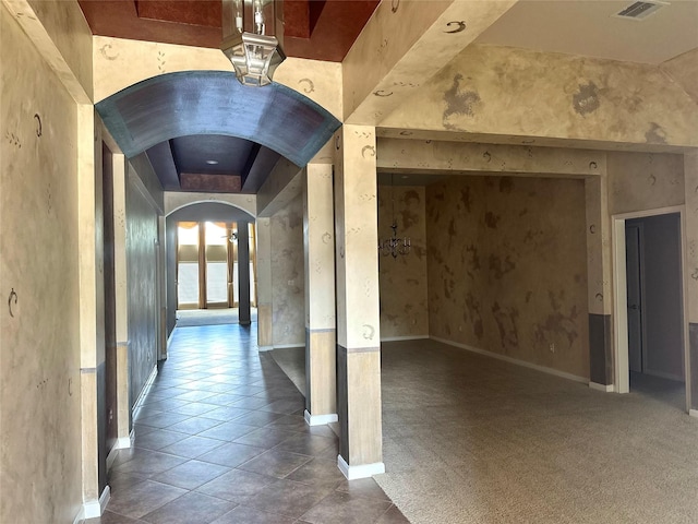 hallway featuring tile patterned flooring