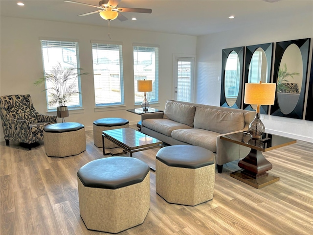 living room featuring hardwood / wood-style flooring, plenty of natural light, and ceiling fan