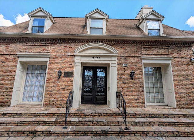 entrance to property featuring french doors