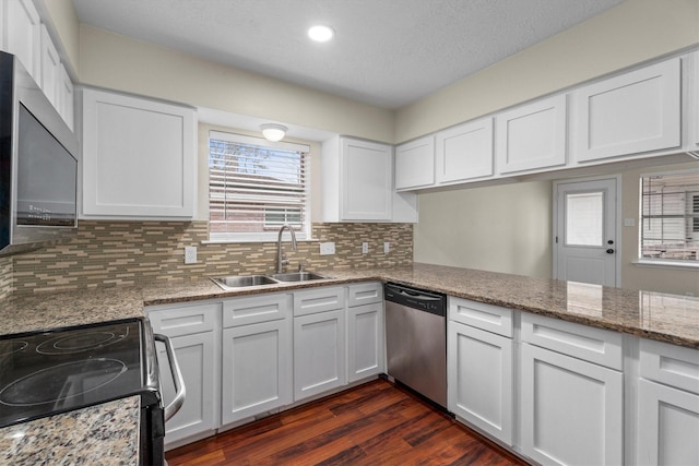 kitchen with white cabinetry, sink, and stainless steel appliances