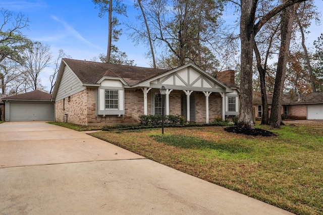 view of front of house with a garage, a porch, and a front yard