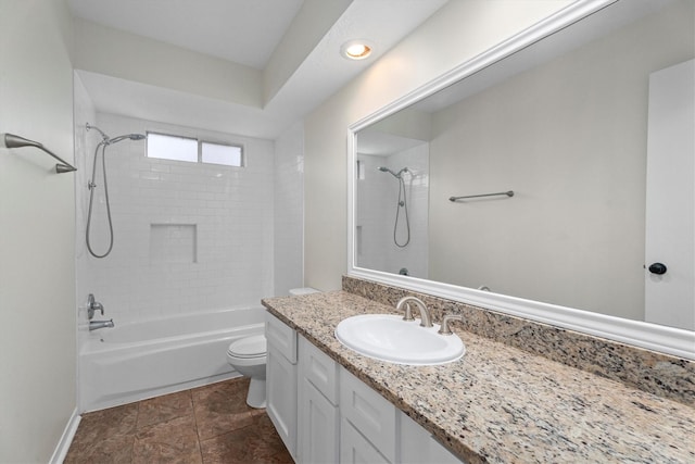 full bathroom with tiled shower / bath combo, vanity, and toilet