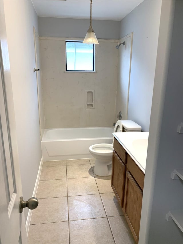 full bathroom featuring vanity, tiled shower / bath combo, tile patterned floors, and toilet