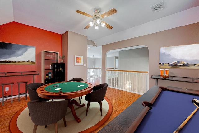 recreation room featuring lofted ceiling, hardwood / wood-style floors, and ceiling fan