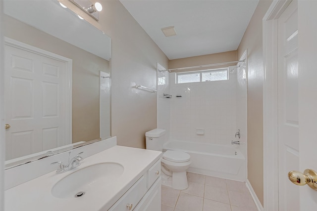 full bathroom with tiled shower / bath, vanity, toilet, and tile patterned flooring