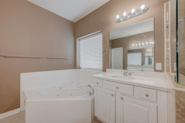 bathroom with tile patterned floors, vanity, and a washtub