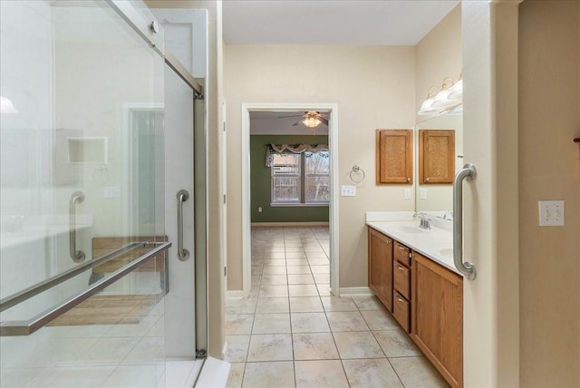 bathroom featuring vanity, a shower with shower door, tile patterned floors, and ceiling fan