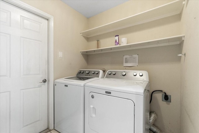 clothes washing area featuring washing machine and dryer