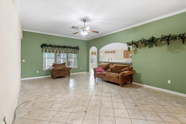 living room with crown molding, ceiling fan, and light tile patterned flooring