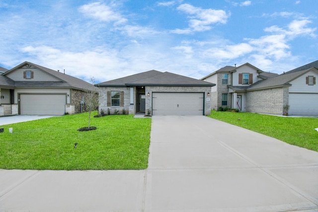 view of front of property with a garage and a front lawn