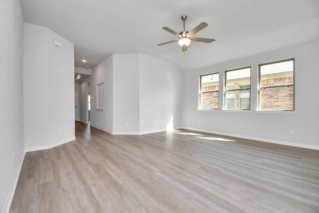 spare room with ceiling fan and light hardwood / wood-style floors