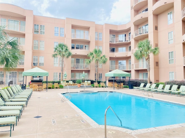 view of swimming pool with a patio area