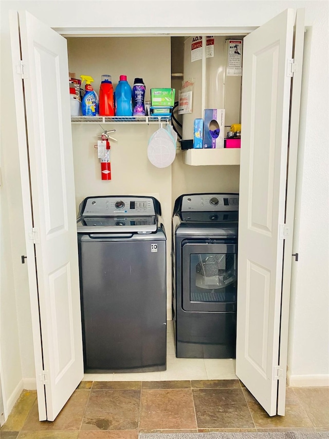 washroom featuring washing machine and clothes dryer