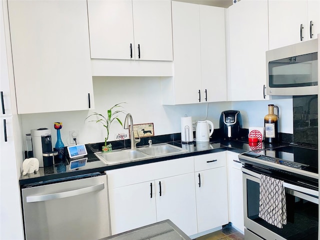 kitchen featuring white cabinetry, sink, and stainless steel appliances