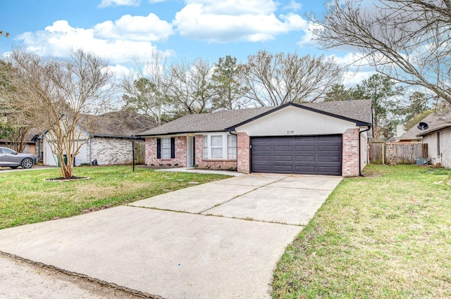 ranch-style home with an attached garage, brick siding, fence, driveway, and a front lawn