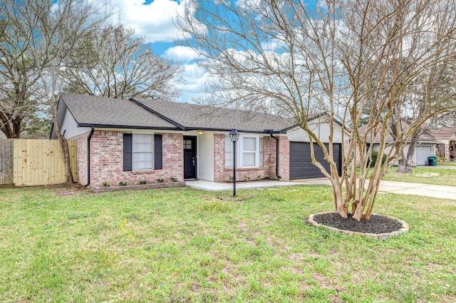 single story home featuring a garage, brick siding, concrete driveway, fence, and a front yard