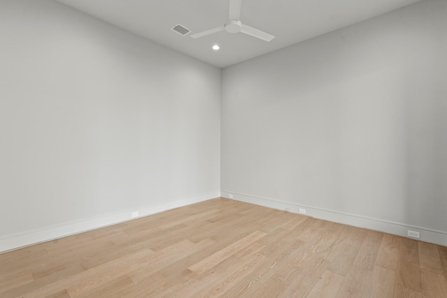 spare room featuring ceiling fan and light wood-type flooring