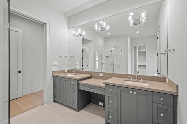 bathroom with vanity, tile patterned flooring, and walk in shower