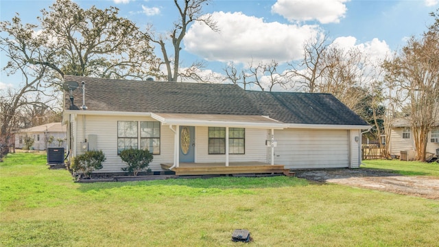 ranch-style house featuring a front yard, covered porch, and central air condition unit