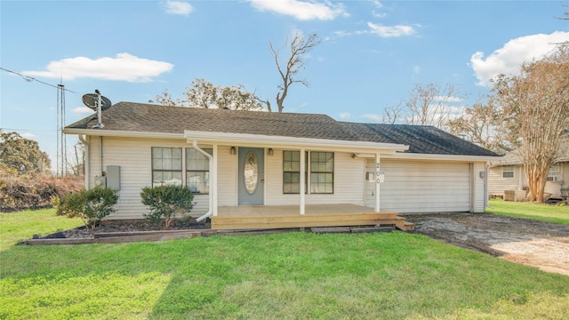 ranch-style home with covered porch and a front yard