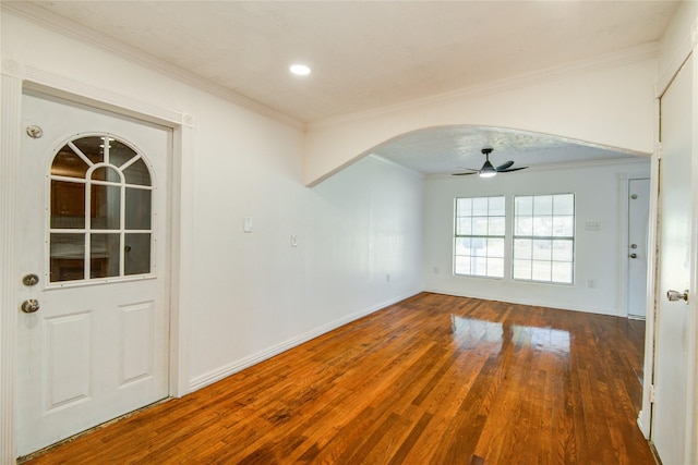 unfurnished room with crown molding, ceiling fan, and wood-type flooring