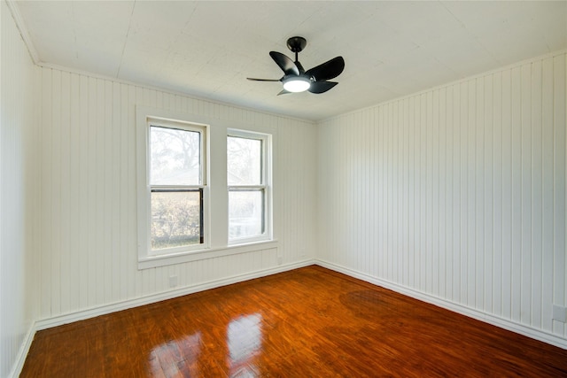 spare room with ceiling fan and wood-type flooring