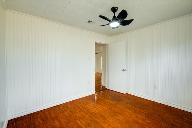 unfurnished room with ceiling fan and wood-type flooring